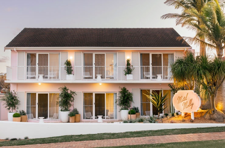 A peachy pink-hued motel in Mollymook, NSW